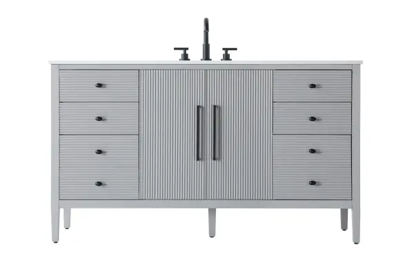 Designed with transitional elegance in mind, this bathroom vanity seamlessly blends traditional elements with modern functionality. Available in five stunning finishes, from the clean sophistication of Crisp White to the natural warmth of Honey Oak, the fluted door and drawer panels add subtle texture and charm. The white engineered marble countertop with natural veining exudes luxury, while the soft-closing doors and drawers with sleek black metal pulls offer a quiet, refined experience. Practicality is never compromised, with features like the U-shaped shelf for plumbing, deeper bottom drawer for ample storage, and pre-drilled faucet holes for easy customization. Whether your style leans modern or classic, this vanity is the perfect balance of beauty and function, appealing to customers with a taste for quality and style. Collection: Blakely Rooms: bathroom Finish: Grey Width: 21.50" Height: 34.00" Length: 60.00" Weight: 238.00 lb Material: Solid wood and MDF Country of Origin: Vietnam Manufacturer Warranty: 1 year limited