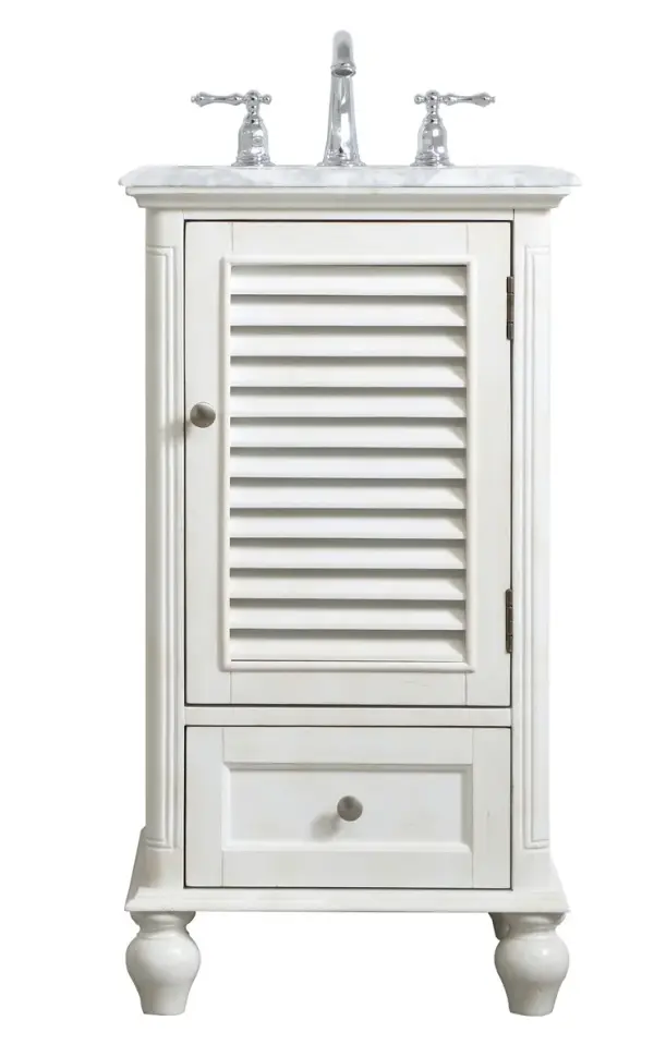 A small space doesn't mean you have to settle for less. The Rhodes collection compact vanity in an antique white finish will add lovely sophistication and complement any small bathroom or powder room, while utilizing its charm and function to provide you with ample storage spaces. Brushed nickel knobs gently adorn the shuttered cabinet door and drawer at the base, allowing for you to store away your bathroom essentials. The Carrara white marble countertop, porcelain undermount sink, dignified subtle engravings on the side edges, and rounded legs all come together to create contemporary beauty. Work with your space, and design a beautiful room, no matter the size. Collection: Rhodes Rooms: bathroom Finish: antique white Width: 19.00" Height: 35.00" Length: 19.00" Weight: 70.00 lb Material: solid wood and mdf Country of Origin: Vietnam Manufacturer Warranty: 1 year limited Spec Sheet