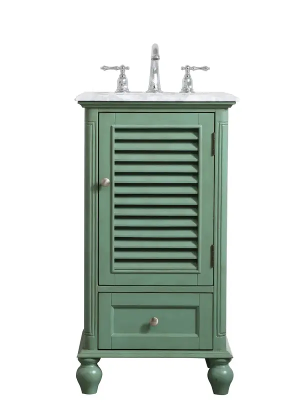 A small space doesn't mean you have to settle for less. The Rhodes collection compact vanity in a vintage mint finish will add a lovely splash of color and complement any small bathroom or powder room, while utilizing its charm and function to provide you with ample storage spaces. Brushed nickel knobs gently adorn the shuttered cabinet door and drawer at the base, allowing for you to store away your bathroom essentials. The Carrara white marble countertop, porcelain undermount sink, dignified subtle engravings on the side edges, and rounded legs all come together to create contemporary beauty. Work with your space, and design a beautiful room, no matter the size. Collection: Rhodes Rooms: bathroom Finish: vintage mint Width: 19.00" Height: 35.00" Length: 19.00" Weight: 70.00 lb Material: solid wood and mdf Country of Origin: Vietnam Manufacturer Warranty: 1 year limited Spec Sheet