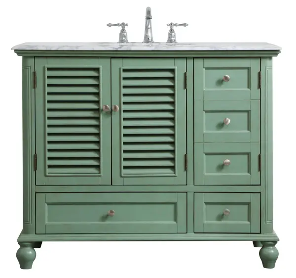 Never compromise beauty--the Rhodes collection stunning vanity in a vintage mint finish will add a lovely splash of color and complement any bathroom or powder room, while utilizing its charm and function to provide you with ample storage spaces. Brushed nickel knobs gently adorn the two drawers at the base, the two shuttered cabinet doors, and the delightful surprising "hidden" cabinet door. Disguised as three drawers, the third cabinet door opens to reveal a space within. These storage areas allows for you to store away your bathroom essentials. The Carrara white marble countertop, porcelain undermount sink, dignified subtle engravings on the side edges, and rounded legs all come together to create contemporary beauty. Work with your space, and design a beautiful room, no matter the size. Collection: Rhodes Rooms: bathroom Finish: vintage mint Width: 22.00" Height: 35.00" Length: 42.00" Weight: 163.00 lb Material: solid wood and mdf Country of Origin: Vietnam Manufacturer Warranty: 1 year limited Spec Sheet