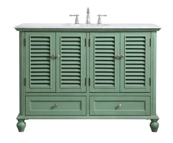 Never compromise beauty--the Rhodes collection stunning vanity in a vintage mint finish will add a lovely splash of color and complement any bathroom or powder room, while utilizing its charm and function to provide you with ample storage spaces. Brushed nickel knobs gently adorn the four shuttered cabinet doors and two long drawers at the base, allowing for you to store away your bathroom essentials. The Carrara white marble countertop, porcelain undermount sink, dignified subtle engravings on the side edges, and rounded legs all come together to create contemporary beauty. Work with your space, and design a beautiful room, no matter the size. Collection: Rhodes Rooms: bathroom Finish: vintage mint Width: 22.00" Height: 35.00" Length: 48.00" Weight: 172.00 lb Material: solid wood and mdf Country of Origin: Vietnam Manufacturer Warranty: 1 year limited Spec Sheet