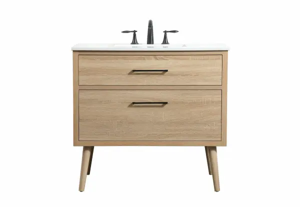 This bathroom vanity is a perfect way to outfit your home in authetic midcentury modern style. The clean lines anchors the design, while the oblique tapered cylinder legs add subtle interest. A black handle adorns the top drawer hiding the base of the undermount porcelain sink while another one allows you to pull the bottom drawer out, letting you store your bathroom necessities and toiletries. The storage drawers provide much needed function and can be used for stowing items like extra toothbrushes, hairbrushes, and other bathroom essentials to help you get ready to face the day. This vanity is a quick update for your bathroom with trendy style. Collection: Boise Rooms: bathroom Finish: mango wood Width: 22.00" Height: 33.50" Length: 36.00" Weight: 115.00 lb Material: Solid wood and MDF Country of Origin: Vietnam Manufacturer Warranty: 1 year limited