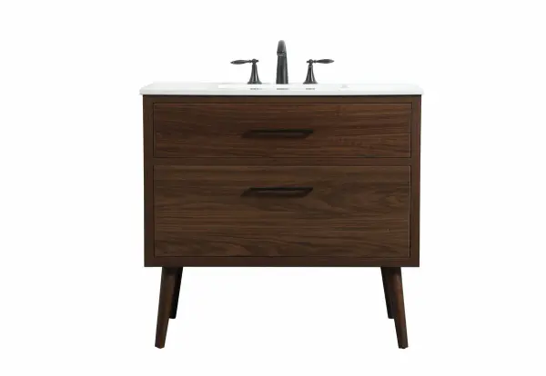This bathroom vanity is a perfect way to outfit your home in authetic midcentury modern style. The clean lines anchors the design, while the oblique tapered cylinder legs add subtle interest. A black handle adorns the top drawer hiding the base of the undermount porcelain sink while another one allows you to pull the bottom drawer out, letting you store your bathroom necessities and toiletries. The storage drawers provide much needed function and can be used for stowing items like extra toothbrushes, hairbrushes, and other bathroom essentials to help you get ready to face the day. This vanity is a quick update for your bathroom with trendy style. Collection: Boise Rooms: bathroom Finish: walnut Width: 22.00" Height: 33.50" Length: 36.00" Weight: 115.00 lb Material: Solid wood and MDF Country of Origin: Vietnam Manufacturer Warranty: 1 year limited