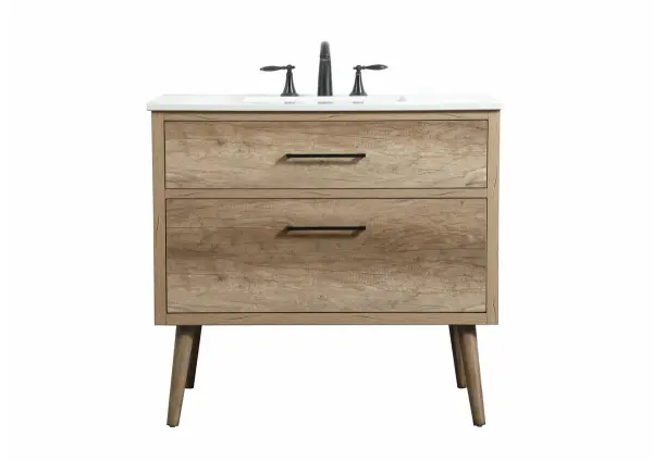This bathroom vanity is a perfect way to outfit your home in authetic midcentury modern style. The clean lines anchors the design, while the oblique tapered cylinder legs add subtle interest. A black handle adorns the top drawer hiding the base of the undermount porcelain sink while another one allows you to pull the bottom drawer out, letting you store your bathroom necessities and toiletries. The storage drawers provide much needed function and can be used for stowing items like extra toothbrushes, hairbrushes, and other bathroom essentials to help you get ready to face the day. This vanity is a quick update for your bathroom with trendy style. Collection: Boise Rooms: bathroom Finish: natural oak Width: 22.00" Height: 33.50" Length: 36.00" Weight: 115.00 lb Material: Solid wood and MDF Country of Origin: Vietnam Manufacturer Warranty: 1 year limited