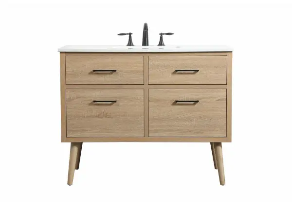 This bathroom vanity is a perfect way to outfit your home in authetic midcentury modern style. The clean lines anchors the design, while the oblique tapered cylinder legs add subtle interest. A black handle adorns the top drawer hiding the base of the undermount porcelain sink while another one allows you to pull the bottom drawer out, letting you store your bathroom necessities and toiletries. The storage drawers provide much needed function and can be used for stowing items like extra toothbrushes, hairbrushes, and other bathroom essentials to help you get ready to face the day. This vanity is a quick update for your bathroom with trendy style. Collection: Boise Rooms: bathroom Finish: Mango Wood Width: 22.00" Height: 33.50" Length: 42.00" Weight: 130.00 lb Material: Solid wood and MDF Country of Origin: Vietnam Manufacturer Warranty: 1 year limited