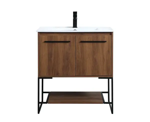 Live in modern comfort with this 30" walnut brown finish vanity. Dressed in a concrete grey and sleek black metal hardware, its contemporary style will have your bathroom or powder room elevated in industrial sophistication. The open shelf at the base and two doors reveal ample storage space for your bathroom essentials and miscellany. Clean lines create its own visual interest, adding trendy looks to your already chic room. Collection: Gerard Rooms: bathroom Finish: Walnut Brown Width: 18.31" Height: 33.46" Length: 30.00" Weight: 73.00 lb Material: MDF, resin, metal Country of Origin: Vietnam Manufacturer Warranty: 1 year limited Spec Sheet