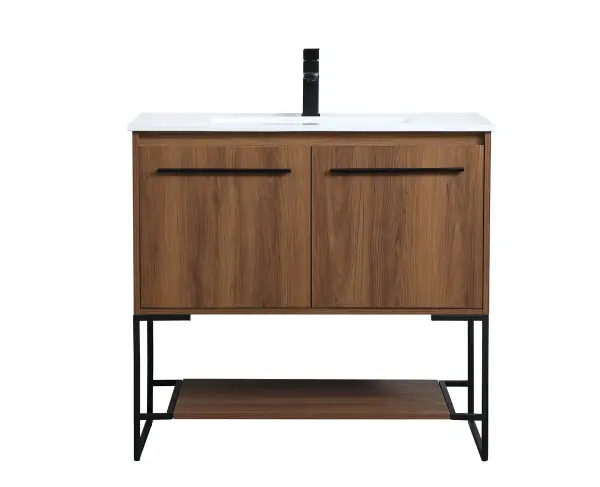 Live in modern comfort with this 36" walnut brown finish vanity. Dressed in a concrete grey and sleek black metal hardware, its contemporary style will have your bathroom or powder room elevated in industrial sophistication. The open shelf at the base and two doors reveal ample storage space for your bathroom essentials and miscellany. Clean lines create its own visual interest, adding trendy looks to your already chic room. Collection: Gerard Rooms: bathroom Finish: Walnut Brown Width: 18.31" Height: 33.46" Length: 36.00" Weight: 86.00 lb Material: MDF, resin, metal Country of Origin: Vietnam Manufacturer Warranty: 1 year limited Spec Sheet