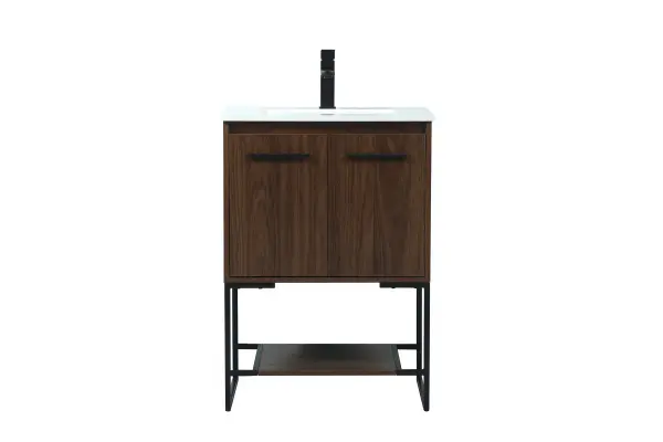 Live in modern comfort with this 24" walnut finish vanity. Dressed in a walnut and sleek black metal hardware, its contemporary style will have your bathroom or powder room elevated in industrial sophistication. The open shelf at the base and two doors reveal ample storage space for your bathroom essentials and miscellany. Clean lines create its own visual interest, adding trendy looks to your already chic room. Collection: Sloane Rooms: bathroom Finish: Walnut Width: 18.00" Height: 33.50" Length: 24.00" Weight: 77.00 lb Material: mdf Country of Origin: Vietnam Manufacturer Warranty: 1 year limited Spec Sheet