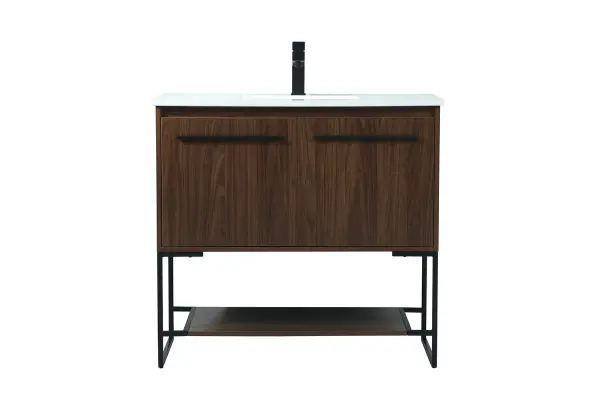 Live in modern comfort with this 36" walnut finish vanity. Dressed in a walnut and sleek black metal hardware, its contemporary style will have your bathroom or powder room elevated in industrial sophistication. The open shelf at the base and two doors reveal ample storage space for your bathroom essentials and miscellany. Clean lines create its own visual interest, adding trendy looks to your already chic room. Collection: Sloane Rooms: bathroom Finish: Walnut Width: 18.00" Height: 33.50" Length: 36.00" Weight: 100.00 lb Material: mdf Country of Origin: Vietnam Manufacturer Warranty: 1 year limited Spec Sheet