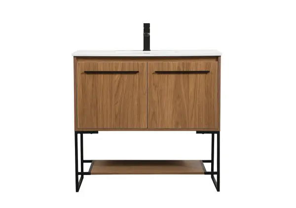Live in comfort with this modern vanity. Dressed in a walnut brown and modern black metal hardware, its sleek style will have your bathroom or powder room elevated in industrial sophistication. The open shelf at the base and two doors reveal ample storage space for your bathroom essentials. Clean lines create its own visual interest, adding trendy looks to your already chic room. Collection: Sloane Rooms: bathroom Finish: Walnut Brown Width: 18.00" Height: 33.50" Length: 36.00" Weight: 100.00 lb Material: MDF Country of Origin: Vietnam Manufacturer Warranty: 1 year limited