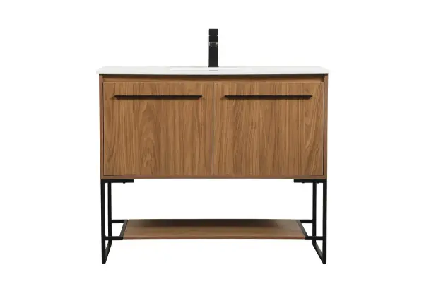 Live in comfort with this modern vanity. Dressed in a walnut brown and modern black metal hardware, its sleek style will have your bathroom or powder room elevated in industrial sophistication. The open shelf at the base and two doors reveal ample storage space for your bathroom essentials. Clean lines create its own visual interest, adding trendy looks to your already chic room. Collection: Sloane Rooms: bathroom Finish: Walnut Brown Width: 18.00" Height: 33.50" Length: 40.00" Weight: 109.00 lb Material: MDF Country of Origin: Vietnam Manufacturer Warranty: 1 year limited