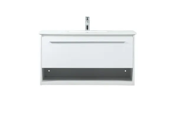 Save space and make your bathroom appear bigger with this floating vanity. Its minimal design will have you in awe, while its clean lines will leave your room feeling fresh and uncluttered. The Single u-drawer pulls out for storage while the open space below allows you to place extra towels or various other essentials. The ivory white engineered marble counter top with porcelain sink adds refined luxe while the aluminum barpull style handle adorn the vanity face. Collection: Roman Rooms: bathroom Finish: White Width: 18.00" Height: 19.70" Length: 36.00" Weight: 94.00 lb Material: MDF Country of Origin: Vietnam Manufacturer Warranty: 1 year limited Spec Sheet