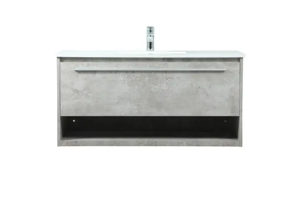 Save space and make your bathroom appear bigger with this floating vanity. Its minimal design will have you in awe, while its clean lines will leave your room feeling fresh and uncluttered. The Single u-drawer pulls out for storage while the open space below allows you to place extra towels or various other essentials. The ivory white engineered marble counter top with porcelain sink adds refined luxe while the aluminum barpull style handle adorn the vanity face. Collection: Roman Rooms: bathroom Finish: Concrete Grey Width: 18.00" Height: 19.70" Length: 40.00" Weight: 101.00 lb Material: MDF Country of Origin: Vietnam Manufacturer Warranty: 1 year limited Spec Sheet