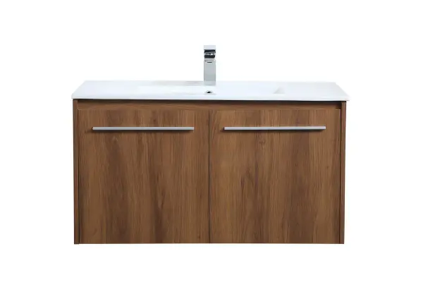 The contemporary simplicity of this 36" floating vanity in a walnut brown finish will help open the space and add stunning modern flair to your bathroom or powder room. The open space below makes it easy to show off your tiles and to clean the floor with ease--it's also the perfect place for a hamper. Double doors open to reveal plentiful of storage pace to store all of your bathroom miscellany. The clean lines that permeate through the design will surely create a fresh look in your home. Collection: Rasina Rooms: bathroom Finish: Walnut Brown Width: 18.31" Height: 19.69" Length: 36.00" Weight: 71.00 lb Material: MDF, resin, metal Country of Origin: Malaysia Manufacturer Warranty: 1 year limited Spec Sheet