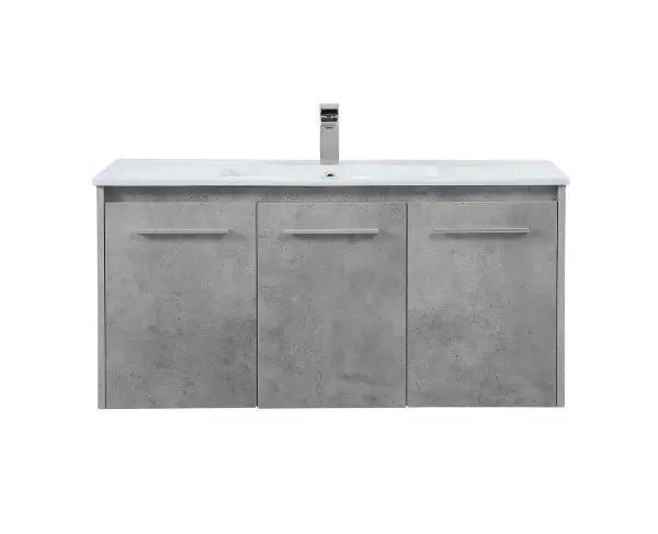 The contemporary simplicity of this 40" floating vanity in a concrete grey finish will help open the space and add stunning modern flair to your bathroom or powder room. The open space below makes it easy to show off your tiles and to clean the floor with ease--it's also the perfect place for a hamper. 3 doors open to reveal plentiful of storage pace to store all of your bathroom miscellany. The clean lines that permeate through the design will surely create a fresh look in your home. Collection: Rasina Rooms: bathroom Finish: Concrete Grey Width: 18.31" Height: 19.69" Length: 40.00" Weight: 86.00 lb Material: MDF, resin, metal Country of Origin: Malaysia Manufacturer Warranty: 1 year limited Spec Sheet