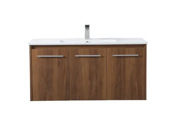 The contemporary simplicity of this 40" floating vanity in a walnut brown finish will help open the space and add stunning modern flair to your bathroom or powder room. The open space below makes it easy to show off your tiles and to clean the floor with ease--it's also the perfect place for a hamper. 3 doors open to reveal plentiful of storage pace to store all of your bathroom miscellany. The clean lines that permeate through the design will surely create a fresh look in your home. Collection: Rasina Rooms: bathroom Finish: Walnut Brown Width: 18.31" Height: 19.69" Length: 40.00" Weight: 86.00 lb Material: MDF, resin, metal Country of Origin: Malaysia Manufacturer Warranty: 1 year limited Spec Sheet