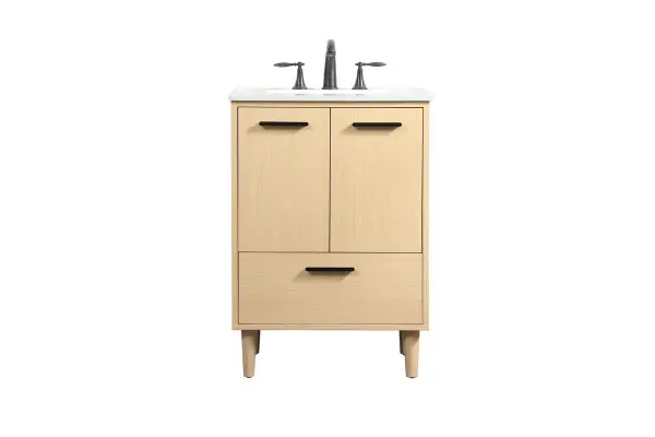 Modern sophistication is defined with the mape finish and black barpulls of this vanity and slender tapered legs. Its length makes it the perfect addition to any sized home, and saves space with its storage area hidden behind the double cabinet doors and one bottom drawer. Topped with a highly durable engineered stone countertop and a porcelain undermount sink, this modern design will become your focal point of your bathroom or powder room. Equipped with soft-closing drawer and doors adds a quiet functional touch. Collection: Baldwin Rooms: Bathroom Finish: Maple Width: 19.00" Height: 34.00" Length: 24.00" Weight: 95.00 lb Material: Solid wood and MDF Country of Origin: Malaysia Manufacturer Warranty: 1 year limited Spec Sheet
