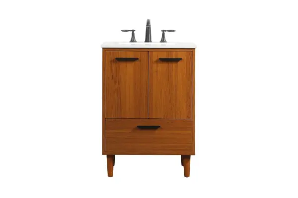 Modern sophistication is defined with the teak finish and black barpulls of this vanity and slender tapered legs. Its length makes it the perfect addition to any sized home, and saves space with its storage area hidden behind the double cabinet doors and one bottom drawer. Topped with a highly durable engineered stone countertop and a porcelain undermount sink, this modern design will become your focal point of your bathroom or powder room. Equipped with soft-closing drawer and doors adds a quiet functional touch. Collection: Baldwin Rooms: Bathroom Finish: Teak Width: 19.00" Height: 34.00" Length: 24.00" Weight: 95.00 lb Material: Solid wood and MDF Country of Origin: Malaysia Manufacturer Warranty: 1 year limited Spec Sheet