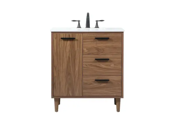 Exquisite modern sophistication is defined with the wood look and black barpulls of this vanity and slender tapered legs. Its length makes it the perfect addition to any sized home, and saves space with its storage area hidden behind the Single cabinet doors and two functional drawers. Topped with a highly durable engineered marble countertop and a porcelain undermount sink, this modern design will become your focal point of your bathroom or powder room. Equipped with soft-closing drawer and doors adds a quiet functional touch. Collection: Baldwin Rooms: bathroom Finish: walnut brown Width: 19.00" Height: 34.00" Length: 30.00" Weight: 120.00 lb Material: Solid wood and MDF Country of Origin: Malaysia Manufacturer Warranty: 1 year limited