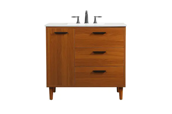 Modern sophistication is defined with the teak finish and black barpulls of this vanity and slender tapered legs. Its length makes it the perfect addition to any sized home, and saves space with its storage area hidden behind the Single cabinet door and two bottom drawers. Topped with a highly durable engineered stone countertop and a porcelain undermount sink, this modern design will become your focal point of your bathroom or powder room. Equipped with soft-closing drawer and doors adds a quiet functional touch. Collection: Baldwin Rooms: Bathroom Finish: Teak Width: 22.00" Height: 34.00" Length: 36.00" Weight: 143.00 lb Material: Solid wood and MDF Country of Origin: Malaysia Manufacturer Warranty: 1 year limited Spec Sheet