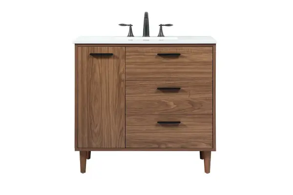 Exquisite modern sophistication is defined with the wood look and black barpulls of this vanity and slender tapered legs. Its length makes it the perfect addition to any sized home, and saves space with its storage area hidden behind the Single cabinet doors and two functional drawers. Topped with a highly durable engineered marble countertop and a porcelain undermount sink, this modern design will become your focal point of your bathroom or powder room. Equipped with soft-closing drawer and doors adds a quiet functional touch. Collection: Baldwin Rooms: bathroom Finish: walnut brown Width: 22.00" Height: 34.00" Length: 36.00" Weight: 143.00 lb Material: Solid wood and MDF Country of Origin: Malaysia Manufacturer Warranty: 1 year limited