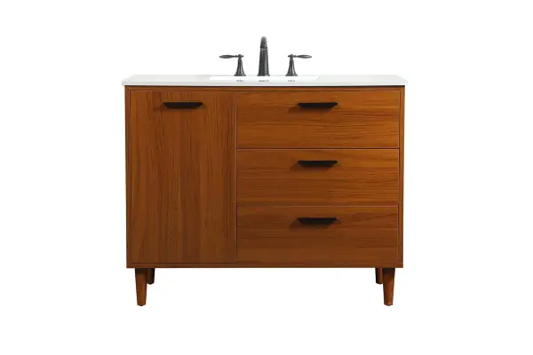 Modern sophistication is defined with the teak finish and black barpulls of this vanity and slender tapered legs. Its length makes it the perfect addition to any sized home, and saves space with its storage area hidden behind the Single cabinet door and two bottom drawers. Topped with a highly durable engineered stone countertop and a porcelain undermount sink, this modern design will become your focal point of your bathroom. Equipped with soft-closing drawer and doors adds a quiet functional touch. Collection: Baldwin Rooms: Bathroom Finish: Teak Width: 22.00" Height: 34.00" Length: 42.00" Weight: 165.00 lb Material: Solid wood and MDF Country of Origin: Malaysia Manufacturer Warranty: 1 year limited Spec Sheet