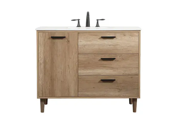 Exquisite modern sophistication is defined with the wood look and black barpulls of this vanity and slender tapered legs. Its length makes it the perfect addition to any sized home, and saves space with its storage area hidden behind the Single cabinet doors and two functional drawers. Topped with a highly durable engineered marble countertop and a porcelain undermount sink, this modern design will become your focal point of your bathroom or powder room. Equipped with soft-closing drawer and doors adds a quiet functional touch. Collection: Baldwin Rooms: bathroom Finish: natural oak Width: 22.00" Height: 34.00" Length: 42.00" Weight: 165.00 lb Material: Solid wood and MDF Country of Origin: Malaysia Manufacturer Warranty: 1 year limited