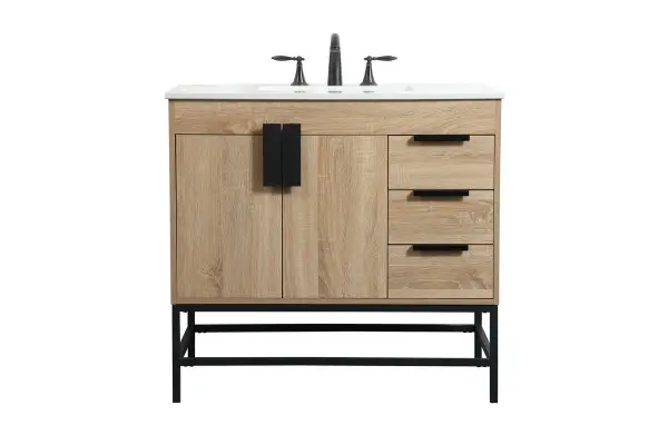 The Eugene vanity blends warm mango wood with powder-coated metal legs for an urban industrial aesthetic. Its 36-inch width fits smaller bathrooms while the soft-close door and oversized handle add modern convenience.