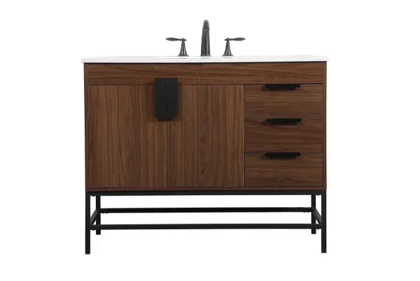 This vanity is a sleek-looking piece of bathroom furniture that is easy to incorporate into your design scheme. The cabinet features a smooth door panel with an oversized steel handle and soft close hinges provide ample room for accessories. Constructed of engineered wood, the powder-coated metal rod legs are an urban industrial look that we love. Minor assembly of the metal legs needed to get this vanity up and running. Collection: Eugene Rooms: bathroom Finish: Walnut Width: 22.00" Height: 33.50" Length: 42.00" Weight: 147.00 lb Material: MDF Country of Origin: Vietnam Manufacturer Warranty: 1 year limited