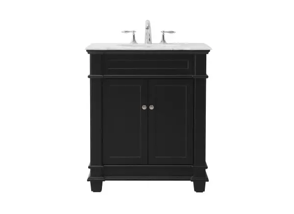 The Wesley Collection vanity cabinet will bring a settle pop of color into your bathroom. The flattering finish is a sophisticated color which creates a calming atmosphere in the room. The brushed nickel knobs bring a vibrant touch to balance the vanity. With the detailed engravings, the cabinet catches eyes with its beautiful lining work. Open the cabinet doors to store what you desire and make use of the spacious area. To top it off, the Carrara white marble adds a luxury and modern finish to the countertop. Collection: Wesley Rooms: bathroom Finish: black Width: 21.50" Height: 35.00" Length: 30.00" Weight: 120.00 lb Material: Solid wood and MDF Country of Origin: Vietnam Manufacturer Warranty: 1 year limited