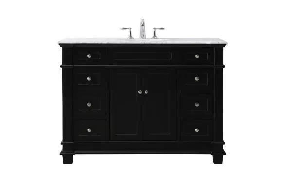 The Wesley Collection vanity cabinet will bring a settle pop of color into your bathroom. The flattering finish is a sophisticated color which creates a calming atmosphere in the room. The brushed nickel knobs bring a vibrant touch to balance the vanity. With the detailed engravings, the cabinet catches eyes with its beautiful lining work. Open the cabinet doors to store what you desire and make use of the spacious area. To top it off, the Carrara white marble adds a luxury and modern finish to the countertop. Collection: Wesley Rooms: bathroom Finish: black Width: 21.50" Height: 35.00" Length: 48.00" Weight: 230.00 lb Material: Solid wood and MDF Country of Origin: Vietnam Manufacturer Warranty: 1 year limited