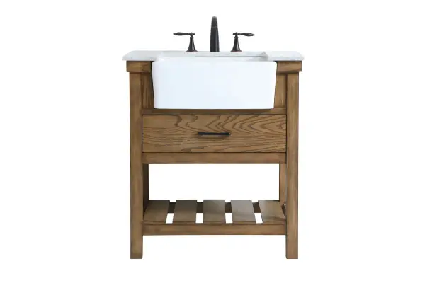 Make the most of your space with this farmhouse style bathroom vanity. Complements well with its beautiful finish, carrara white marble countertop, and the contemporary slender handle bar that sits on the functional drawers with soft closing mechanism, allowing you to store an assortment of bathroom essentials. The lower shelf makes it the perfect space to hold new towels for your guests. This stylish vanity ensures both form and function in your bathroom for you and your guests. Collection: Clement Rooms: bathroom Finish: driftwood Width: 22.00" Height: 34.13" Length: 30.00" Weight: 123.00 lb Material: Solid wood and MDF Country of Origin: Vietnam Manufacturer Warranty: 1 year limited