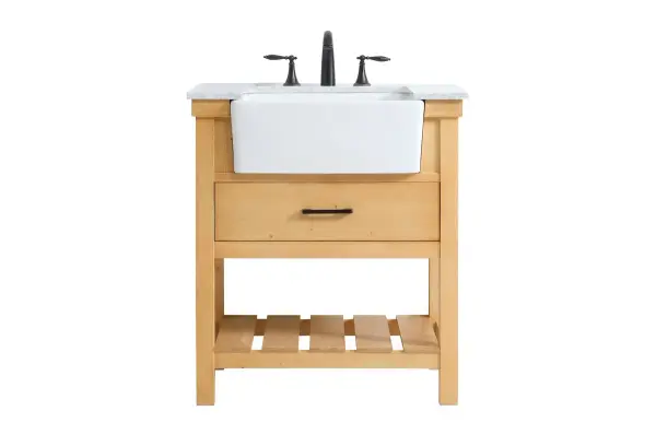 Make the most of your space with this farmhouse style bathroom vanity. Complements well with its beautiful finish, carrara white marble countertop, and the contemporary slender handle bar that sits on the functional drawers with soft closing mechanism, allowing you to store an assortment of bathroom essentials. The lower shelf makes it the perfect space to hold new towels for your guests. This stylish vanity ensures both form and function in your bathroom for you and your guests. Collection: Clement Rooms: bathroom Finish: natural wood Width: 22.00" Height: 34.13" Length: 30.00" Weight: 123.00 lb Material: Solid wood and MDF Country of Origin: Vietnam Manufacturer Warranty: 1 year limited