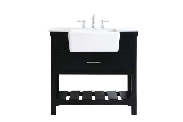 Make the most of your space with this farmhouse style bathroom vanity. Complements well with its beautiful finish, carrara white marble countertop, and the contemporary slender handle bar that sits on the functional drawers with soft closing mechanism, allowing you to store an assortment of bathroom essentials. The lower shelf makes it the perfect space to hold new towels for your guests. This stylish vanity ensures both form and function in your bathroom for you and your guests. Collection: Clement Rooms: bathroom Finish: black Width: 22.00" Height: 34.13" Length: 36.00" Weight: 143.00 lb Material: Solid wood and MDF Country of Origin: Vietnam Manufacturer Warranty: 1 year limited