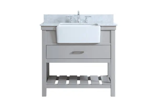 Make the most of your space with this farmhouse style bathroom vanity. Complements well with its beautiful finish, carrara white marble countertop, and the contemporary slender handle bar that sits on the functional drawers with soft closing mechanism, allowing you to store an assortment of bathroom essentials. The lower shelf makes it the perfect space to hold new towels for your guests. This stylish vanity ensures both form and function in your bathroom for you and your guests. Comes with a matching backsplash to complete the look and protects your wall. Collection: Clement Rooms: bathroom Finish: grey Width: 22.00" Height: 34.13" Length: 36.00" Weight: 152.00 lb Material: Solid wood and MDF Country of Origin: Vietnam Manufacturer Warranty: 1 year limited