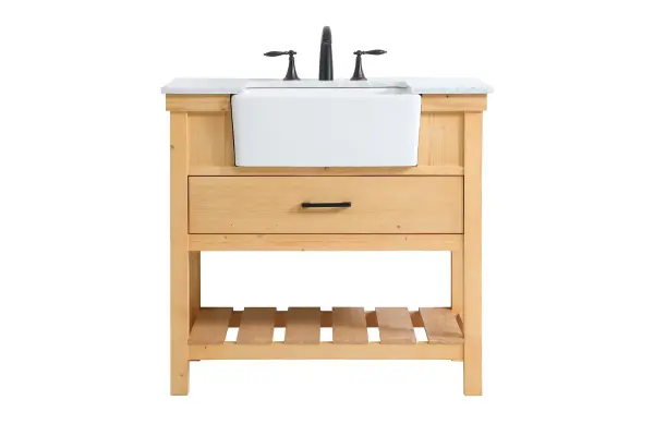 Make the most of your space with this farmhouse style bathroom vanity. Complements well with its beautiful finish, carrara white marble countertop, and the contemporary slender handle bar that sits on the functional drawers with soft closing mechanism, allowing you to store an assortment of bathroom essentials. The lower shelf makes it the perfect space to hold new towels for your guests. This stylish vanity ensures both form and function in your bathroom for you and your guests. Collection: Clement Rooms: bathroom Finish: natural wood Width: 22.00" Height: 34.13" Length: 36.00" Weight: 143.00 lb Material: Solid wood and MDF Country of Origin: Vietnam Manufacturer Warranty: 1 year limited