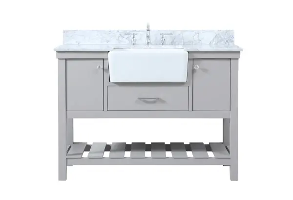 Make the most of your space with this farmhouse style bathroom vanity. Complements well with its beautiful finish, carrara white marble countertop, and the contemporary slender handle bar that sits on the functional drawers with soft closing mechanism, allowing you to store an assortment of bathroom essentials. The lower shelf makes it the perfect space to hold new towels for your guests. This stylish vanity ensures both form and function in your bathroom for you and your guests. Comes with a matching backsplash to complete the look and protects your wall. Collection: Clement Rooms: bathroom Finish: grey Width: 22.00" Height: 34.13" Length: 48.00" Weight: 197.00 lb Material: Solid wood and MDF Country of Origin: Vietnam Manufacturer Warranty: 1 year limited