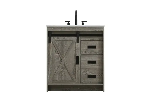 Transform your bathroom with this rustic barnyard-style vanity, designed to balance aesthetic appeal and functionality. Featuring a sliding barn door with black metal hardware and complementary handle pulls, this piece blends rugged charm with practical design. The engineered marble countertop displays unique marbling, while the porcelain undermount sink offers easy maintenance and durability. Available in Espresso, Natural Oak, and Rustic Grey finishes, this vanity suits a range of styles. It includes a deep storage drawer for larger items, a hidden shelf for towels or décor, and adjustable foot levelers for added stability on uneven floors. With pre-drilled faucet holes for easy setup, this vanity delivers style and substance to enhance your bathroom. Collection: Austin Rooms: bathroom Finish: Rustic Grey Width: 30.00" Height: 22.00" Length: 30.00" Weight: 126.00 lb Material: MDF Country of Origin: Malaysia Manufacturer Warranty: 1 year limited