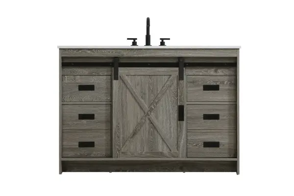 Transform your bathroom with this rustic barnyard-style vanity, designed to balance aesthetic appeal and functionality. Featuring a sliding barn door with black metal hardware and complementary handle pulls, this piece blends rugged charm with practical design. The engineered marble countertop displays unique marbling, while the porcelain undermount sink offers easy maintenance and durability. Available in Espresso, Natural Oak, and Rustic Grey finishes, this vanity suits a range of styles. It includes a deep storage drawer for larger items, a hidden shelf for towels or décor, and adjustable foot levelers for added stability on uneven floors. With pre-drilled faucet holes for easy setup, this vanity delivers style and substance to enhance your bathroom. Collection: Austin Rooms: bathroom Finish: Rustic Grey Width: 48.00" Height: 22.00" Length: 48.00" Weight: 200.00 lb Material: MDF Country of Origin: Malaysia Manufacturer Warranty: 1 year limited