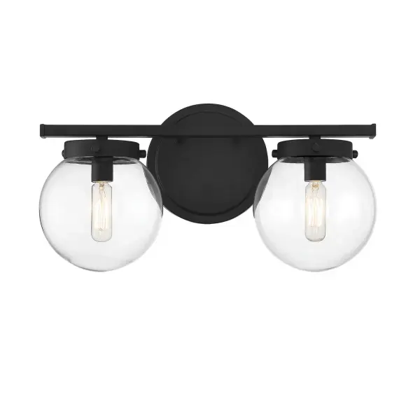 Add a bubbly look to your bath with this Meridian 2-light bath bar! Its streamlined design features globes of clear glass, a shape that is echoed in the circular backplate. This light will really pop in bathrooms with contemporary, modern and midcentury modern styles. Finished in matte black, it is also damp area rated. This bath light is 8" in height and 16" in width. It extends 7.25" from the wall and can be mounted with the shades facing up or down. It uses 2 candelabra size bulbs of up to 60 watts each, is dimmable and is LED compatible. Rooms: Bathroom, Powder Room Finish: Matte Black Glass: Clear Width: 16.00" Height: 8.00" Weight: 2.86 lb Extension from Wall: 7.25" Canopy: 6"x0.75" Number of Bulbs: 2 Maximum Wattage: 60.00 W Bulb Type: T6 Bulb Base: E12 Light Source: Incandescent/LED Dimmable Voltage: 120.00 V Material: Metal, Glass Safety Listing: UL/CUL Safety Rating: Damp LED