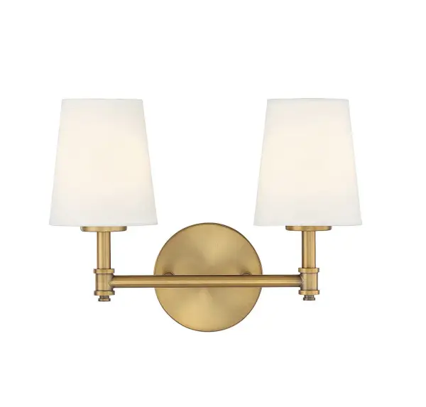 This Meridian 2-light bath vanity light is big in tailored traditional style! Featuring white linen fabric shades, a simply pleasing look and a natural brass finish. 9.5" height, 15" width, extends 7" from wall. Max 60 watts per bulb, candelabra size C11 bulbs recommended. LED bulb compatible. Damp area rated. Rooms: Bathroom, Powder Room Finish: Natural Brass Glass: White Linen Fabric Width: 15.00" Height: 9.50" Weight: 1.98 lb Extension from Wall: 7.00" Canopy: 5"x5"x0.75" Number of Bulbs: 2 Maximum Wattage: 60.00 W Bulb Type: E-12 Bulb Base: E12 Light Source: Incandescent/LED Dimmable Voltage: 120.00 V Material: Metal, Fabric Safety Listing: UL/CUL Safety Rating: Damp LED