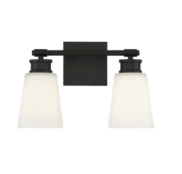 Simply stylish and cleanly classic, this Meridian 2-light bath vanity bar offers shades of milk glass and a matte black finish for bright yet comfortable illumination. 9.5" height, 14" width, extends 6.5" from wall. Max 60 watts per bulb, standard size A19 bulbs recommended. LED bulb compatible. Damp area rated. Rooms: Bathroom, Powder Room Finish: Matte Black Glass: Milk Width: 14.00" Height: 9.50" Weight: 4.20 lb Extension from Wall: 6.50" Canopy: 4.75"x4.75"x0.75" Number of Bulbs: 2 Maximum Wattage: 60.00 W Bulb Type: A-19 Bulb Base: E26 Light Source: Incandescent/LED Dimmable Voltage: 120.00 V Material: Metal, Glass Safety Listing: UL/CUL Safety Rating: Damp LED