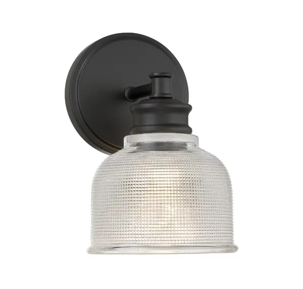 This 1-light sconce helps you bring a touch of vintage inspiration to any space. It has a highly textured shade of glass and a matte black finish. 9.5" height, 5" width. Uses standard size bulb, max 60 watts. LED bulb compatible. Rooms: Bathroom, Bedroom, Billiard Room, Closet, Dining Room, Entryway, Family Room, Great Room, Kitchen, Hallway, Living Room, Office, Powder Room, Stairway, Sunroom, Lobby, Waiting Room, Media Room Finish: Matte Black Glass: Clear Halophane Width: 5.00" Height: 9.50" Weight: 2.82 lb Extension from Wall: 6.50" Canopy: 0.75"x5" Number of Bulbs: 1 Maximum Wattage: 60.00 W Bulb Type: E26 Bulb Base: E26 Light Source: Incandescent/LED Dimmable Voltage: 120.00 V Material: Metal, Glass Safety Listing: UL/CUL Safety Rating: Damp LED