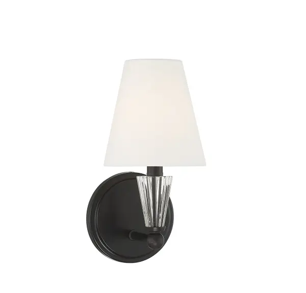 This 1-light sconce features a touch of sparkle that adds a big dose of glamour to any space! A faceted crystal accent sits on the arm, its shape echoing the white fabric shade. Matte Black finish. 11.5" height, 5.5" width, extends 7" from the wall. It uses 1 candelabra size bulb with a max of 60 watts (not included). Damp area rated. Install as shown. Rooms: Bathroom, Bedroom, Billiard Room, Closet, Dining Room, Entryway, Family Room, Great Room, Kitchen, Hallway, Living Room, Office, Powder Room, Stairway, Sunroom, Lobby, Waiting Room, Media Room Finish: Matte Black Glass: White Fabric Crystal: Faceted Crystal Accent Width: 5.50" Height: 11.50" Weight: 1.37 lb Extension from Wall: 7.00" Canopy: 5"x5"x0.75" Number of Bulbs: 1 Maximum Wattage: 60.00 W Bulb Type: E12 Bulb Base: E12 Light Source: Incandescent/LED Dimmable Voltage: 120.00 V Material: Metal, Fabric Safety Listing: ETL/CETL Safety Rating: Damp LED