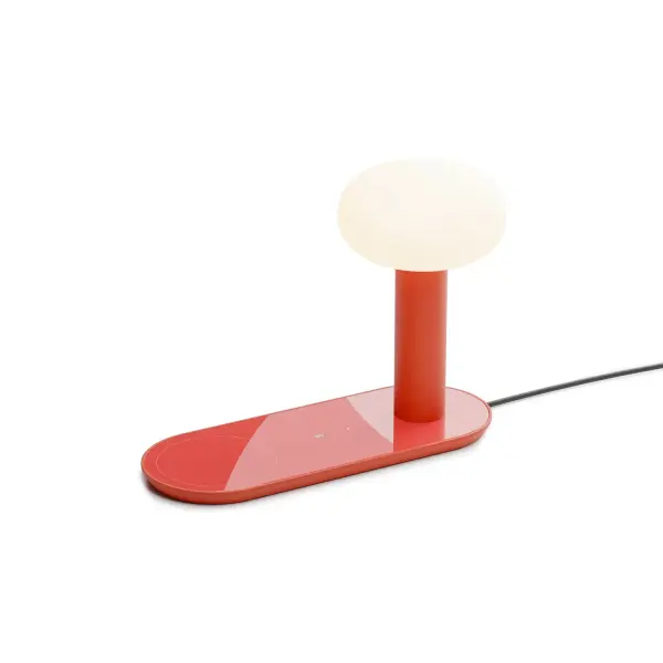 The Combi table lamp offers the convenience of a multi-functional design, combining a stylish table lamp with a smart device charging station. It features a high power USB-C port charger for corded charging and a wireless charger for Qi-enabled devices, ensuring a hassle-free charging experience. With its sleek design and clutter-free setup, the Combi table lamp is ideal for workspaces, reading areas, or bedside tables, providing both functionality and style. Collection: Combi Designer: Kenneth Ng, Edmund Ng Finish: Matte Red Width: 4.00" Height: 7.50" Length: 10.30" Weight: 5.50 lb Maximum Wattage: 7.70 W Bulb Type: LED Bulb Base: Integrated Light Source: LED Light Output: 330.00 lm Color Temperature: 2700 K CRI: 90 Voltage: 100.00 V Material: Glass, Aluminum, Zinc Alloy Country of Origin: China Safety Listing: UL/cUL LED Manufacturer Warranty: 5 years Spec Sheet