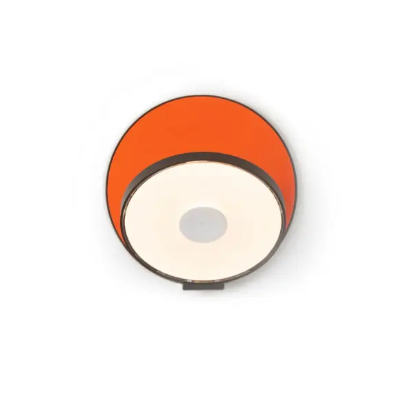 The Gravy LED Wall Sconce combines minimalist design with maximum functionality. Its fully articulating joint allows precise light direction for ambient or task lighting, while integrated touch controls make dimming effortless. The striking metallic black and matte orange finish adds a contemporary pop of color to any space.