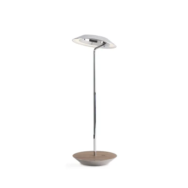 The Royyo Desk lamp adds an elegant flair to any space with its minimal wiring and pleasing circular design. Its minimal silhouette houses complex inner technology for a marriage of form and functionality. Royyo's embedded USB port allows users to charge any USB - compatible device. Interchangeable base plate options allow users to customize at ease. Achieve unity in design by inviting the Royyo Floor Lamp, Royyo Pendant and Royyo Desk Lamp into your home. Collection: Royyo Designer: Kenneth Ng, Edmund Ng Finish: Chrome, Oiled Walnut Width: 6.40" Height: 17.40" Length: 6.40" Weight: 2.60 lb Bulbs Included Maximum Wattage: 11.00 W Bulb Type: LED Bulb Base: Integrated Light Source: LED Light Output: 600.00 lm Color Temperature: 3000 K CRI: 90 Voltage: 120.00 V Material: Aluminum, plastic Country of Origin: China Safety Listing: UL, CUL Safety Rating: Damp LED Manufacturer Warranty: 5 years Spec Sheet