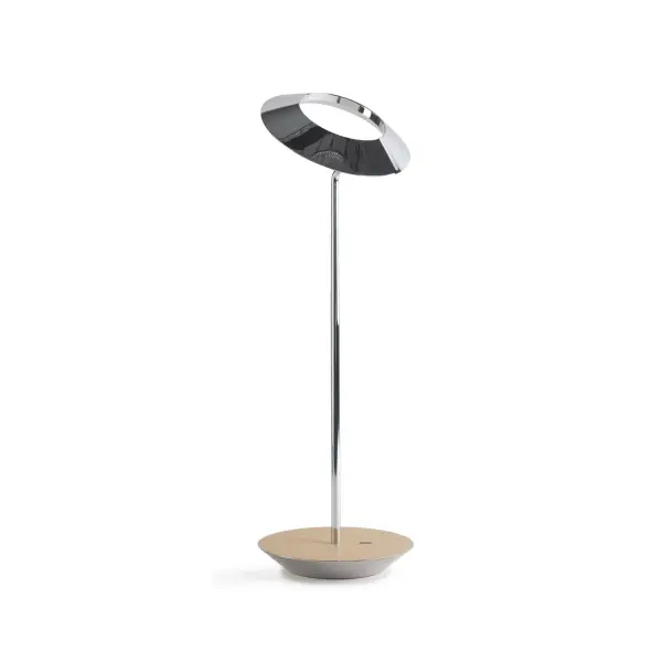 The Royyo Desk lamp adds an elegant flair to any space with its minimal wiring and pleasing circular design. Its minimal silhouette houses complex inner technology for a marriage of form and functionality. Royyo's embedded USB port allows users to charge any USB - compatible device. Interchangeable base plate options allow users to customize at ease. Achieve unity in design by inviting the Royyo Floor Lamp, Royyo Pendant and Royyo Desk Lamp into your home. Collection: Royyo Designer: Kenneth Ng, Edmund Ng Finish: Chrome, White Oak Width: 6.40" Height: 17.40" Length: 6.40" Weight: 2.60 lb Bulbs Included Maximum Wattage: 11.00 W Bulb Type: LED Bulb Base: Integrated Light Source: LED Light Output: 600.00 lm Color Temperature: 3000 K CRI: 90 Voltage: 120.00 V Material: Aluminum, plastic Country of Origin: China Safety Listing: UL, CUL Safety Rating: Damp LED Manufacturer Warranty: 5 years Spec Sheet