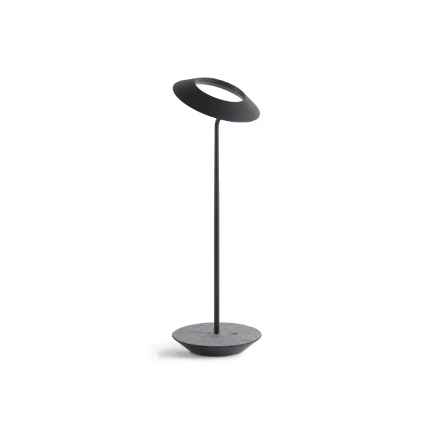 The Royyo Desk lamp adds an elegant flair to any space with its minimal wiring and pleasing circular design. Its minimal silhouette houses complex inner technology for a marriage of form and functionality. Royyo's embedded USB port allows users to charge any USB - compatible device. Interchangeable base plate options allow users to customize at ease. Achieve unity in design by inviting the Royyo Floor Lamp, Royyo Pendant and Royyo Desk Lamp into your home. Collection: Royyo Designer: Kenneth Ng, Edmund Ng Finish: Matte Black, Oxford Felt Width: 6.40" Height: 17.40" Length: 6.40" Weight: 2.60 lb Bulbs Included Maximum Wattage: 11.00 W Bulb Type: LED Bulb Base: Integrated Light Source: LED Light Output: 600.00 lm Color Temperature: 3000 K CRI: 90 Voltage: 120.00 V Material: Aluminum, plastic Country of Origin: China Safety Listing: UL, CUL Safety Rating: Damp LED Manufacturer Warranty: 5 years Spec Sheet