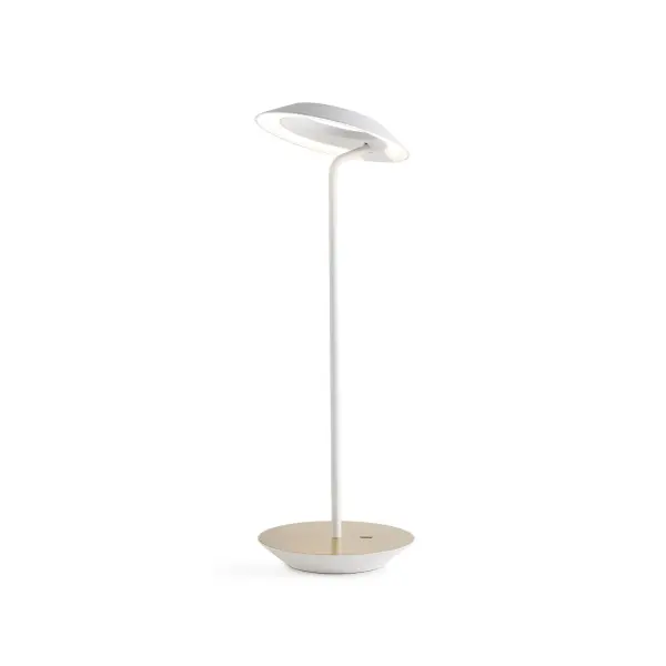 The Royyo Desk lamp adds an elegant flair to any space with its minimal wiring and pleasing circular design. Its minimal silhouette houses complex inner technology for a marriage of form and functionality. Royyo's embedded USB port allows users to charge any USB - compatible device. Interchangeable base plate options allow users to customize at ease. Achieve unity in design by inviting the Royyo Floor Lamp, Royyo Pendant and Royyo Desk Lamp into your home. Collection: Royyo Designer: Kenneth Ng, Edmund Ng Finish: Matte White, Brass Width: 6.40" Height: 17.40" Length: 6.40" Weight: 2.60 lb Bulbs Included Maximum Wattage: 11.00 W Bulb Type: LED Bulb Base: Integrated Light Source: LED Light Output: 600.00 lm Color Temperature: 3000 K CRI: 90 Voltage: 120.00 V Material: Aluminum, plastic Country of Origin: China Safety Listing: UL, CUL Safety Rating: Damp LED Manufacturer Warranty: 5 years Spec Sheet